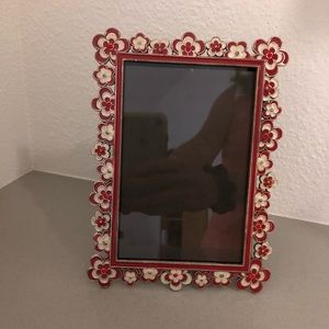 70’s flower power inspired red and white metal frame